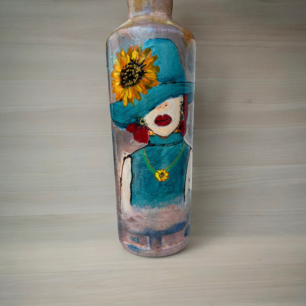 
                      
                        Hand Painted Glass Bottle - Lady in Blue hat
                      
                    