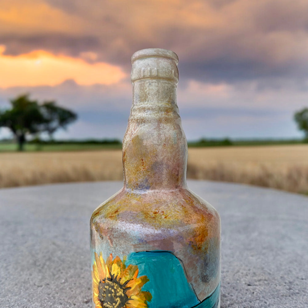 
                      
                        Hand Painted Glass Bottle - Lady in Blue hat
                      
                    
